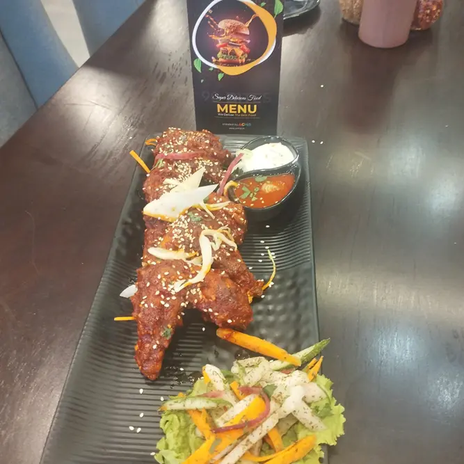 Schezwan Wings by Acmo Network